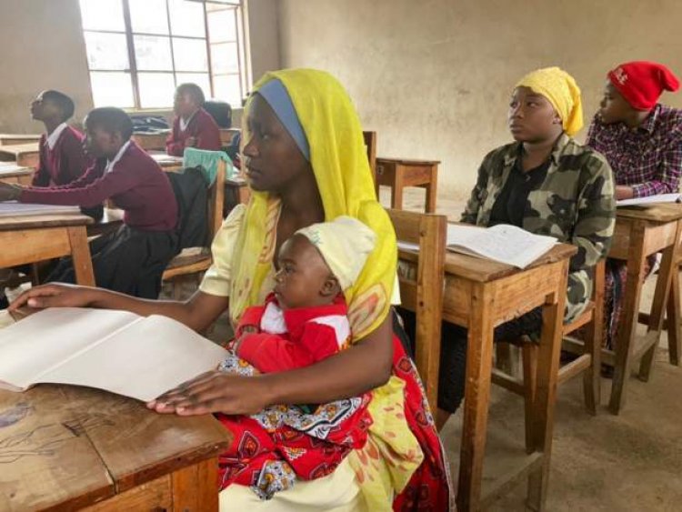 Tanzanian schoolgirl returns to class with baby