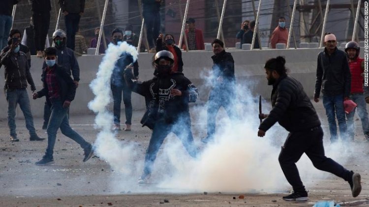 Nepalese police use tear gas and water cannons to disperse protesters over a 'gift' from the United States.