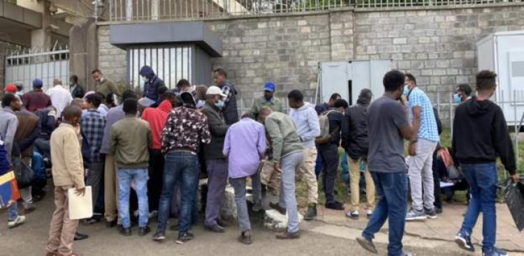 Ethiopians line up at the Russian embassy to enlist in the military.