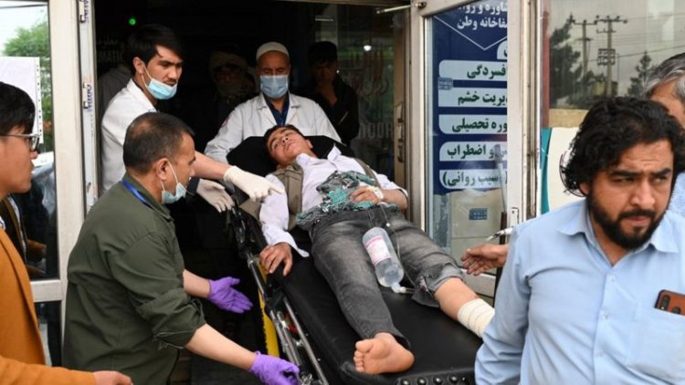 Blasts at a boys' school in Kabul kill four people and injure many more.