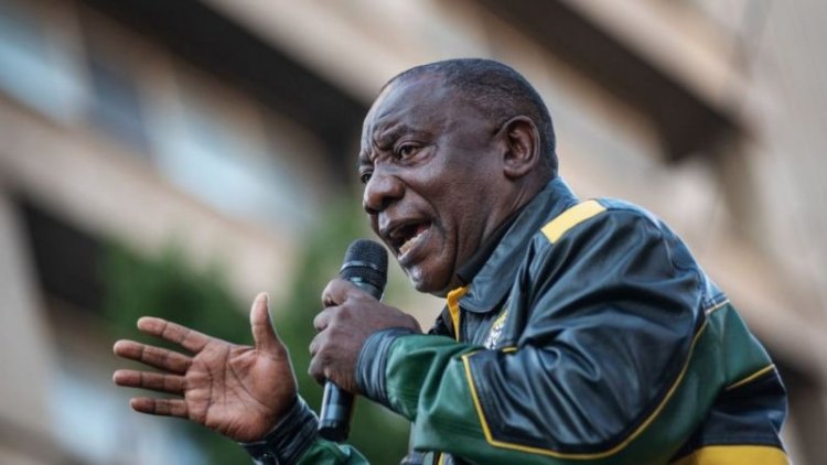 Cyril Ramaphosa of South Africa leaves a May Day rally after being booed.