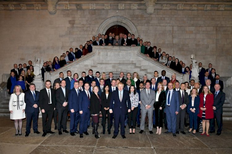 Boris Johnson poses with over 100 newly elected Tory MPs