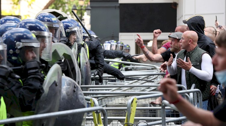 Police struggle to keep rival protesters apart as tensions rise