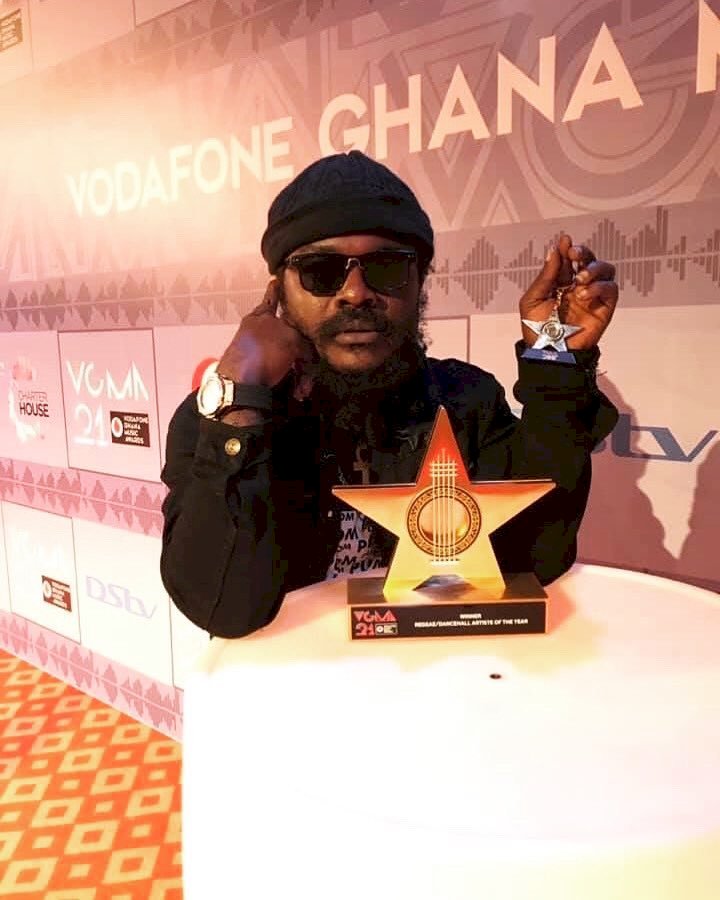 Ras Kuuku Replies Critics after being trolled for parading his VGMA award